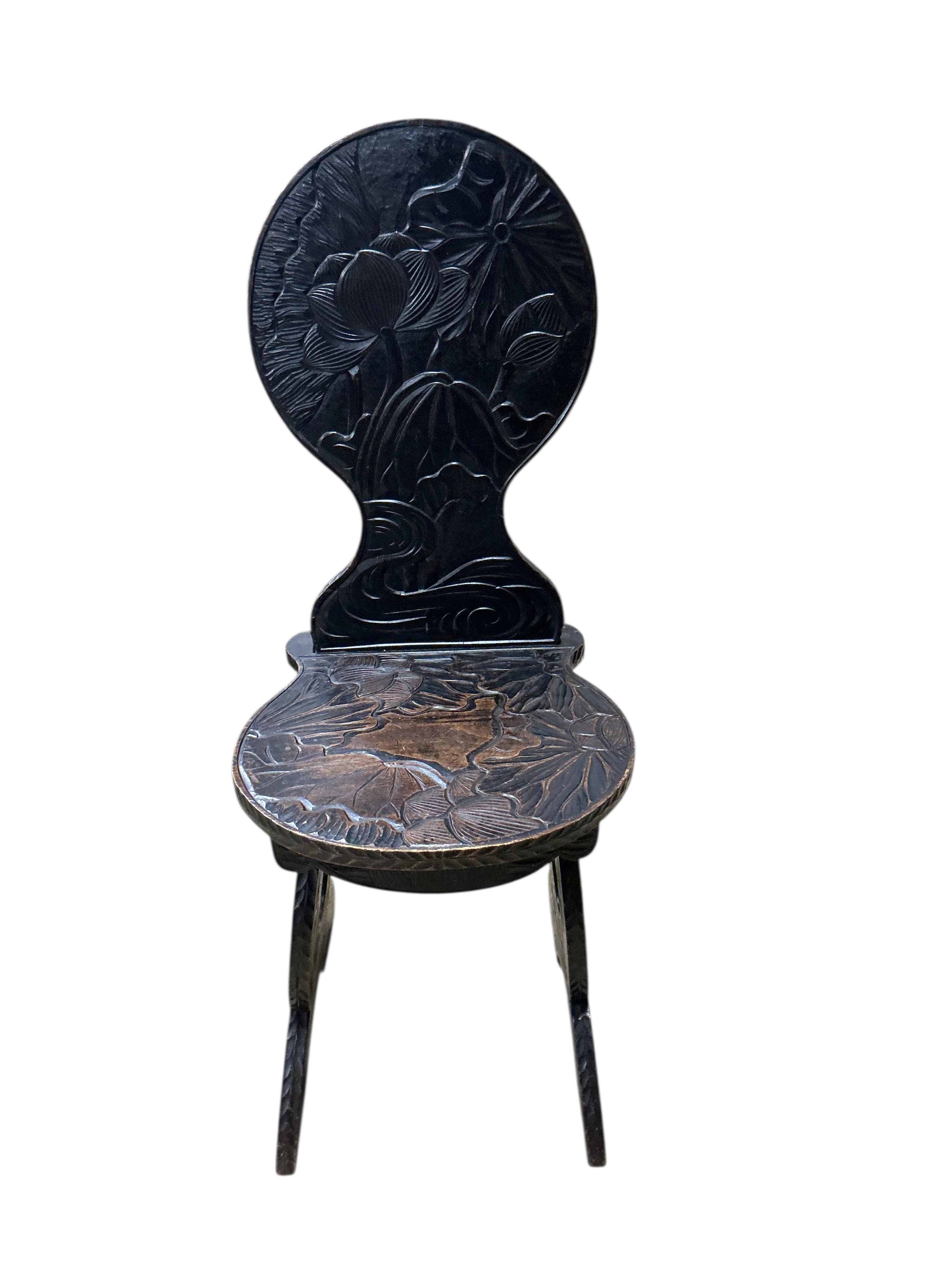 A Japanese carved hardwood hall chair for Liberty, width 39cm, depth 44cm, height 100cm